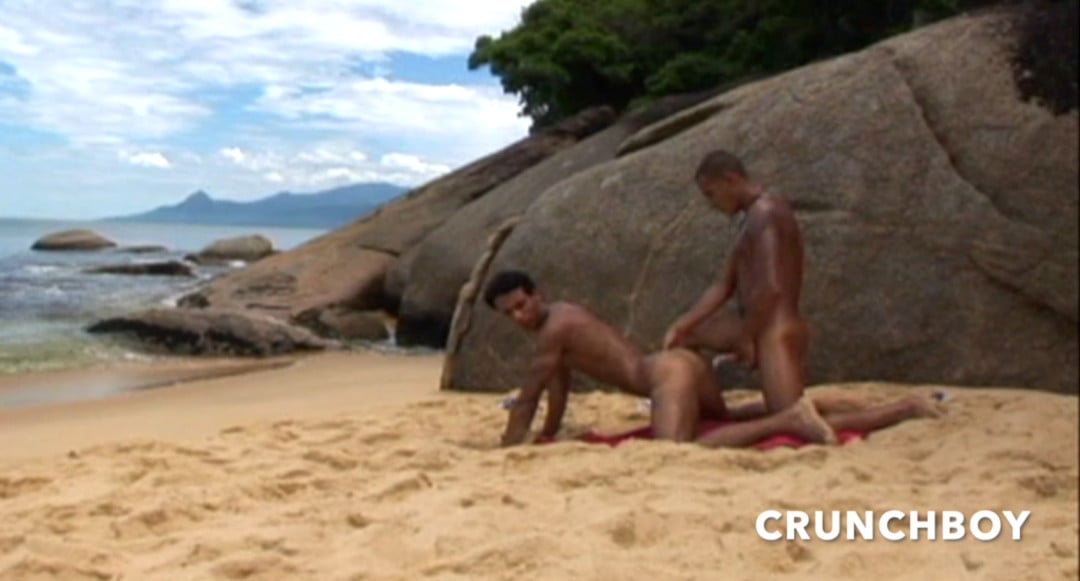 Two handsome Latinos fuck on a public beach
