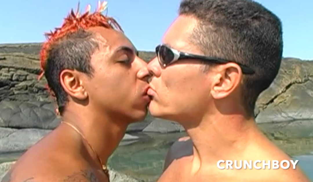 Two young Latinos fuck on a public beach